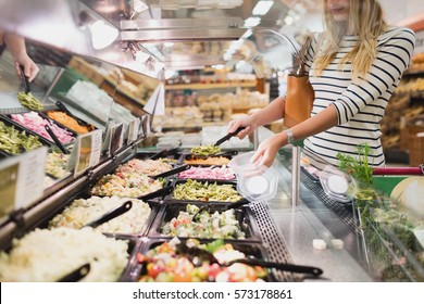 Blonde Woman Buying Pasta Prepared Meal In Grocery Store