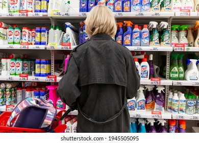 Blonde Woman Chooses Cleaning Products For The House In The Store. Back View. Moscow, Russia, 10-25-2020. 