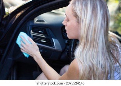 Blonde Woman Cleaning Car Interior