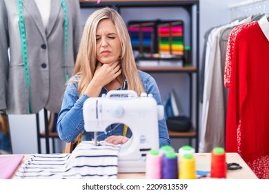 Blonde Woman Dressmaker Designer Using Sew Machine Touching Painful Neck, Sore Throat For Flu, Clod And Infection 