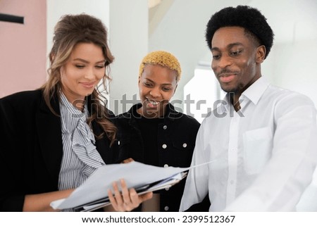 The blonde woman female real estate consultant provided valuable insights into market trends and helped the african american dark skinned investors make an informed decision.