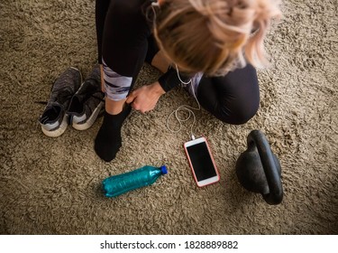 Blonde Woman Getting Dressed For Workout