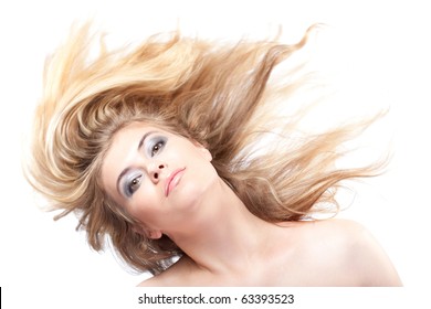 Blonde Woman With Her Hair Blowing Looking At Camera