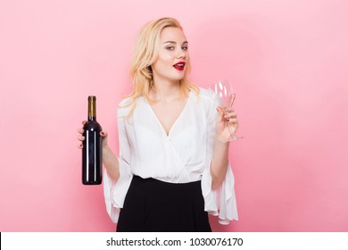 Blonde Woman Holding Wine Bottle And Glass