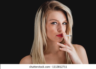 Blonde Woman Portrait Wearing Eyeliner And Red Lipstick And Smoking Cigarette