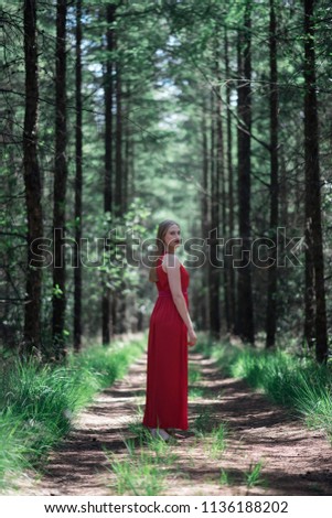 Similar – Mädchen in rotem Kleid im Wald