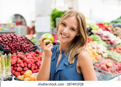 Blonde Woman Shopping Organic Veggies And Fruits