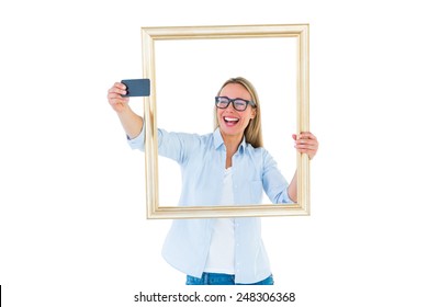 Blonde Woman Taking A Selfie Through A Frame On White Background