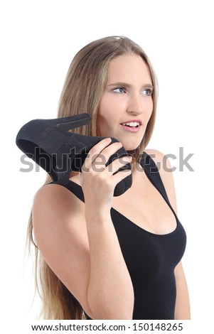 Blonde woman talking on the phone using a heel on the ear isolated on a white background