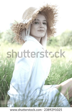 Similar – Image, Stock Photo Blonde woman with hat taking a walk in the forest at sunset with the sun in the background.