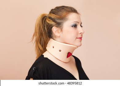 Blonde Woman Wearing Neck Protector, Side View