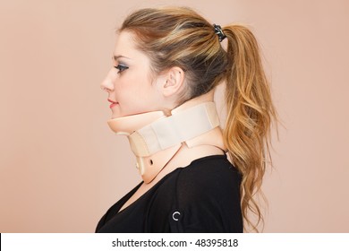 Blonde Woman Wearing Neck Protector, Side View