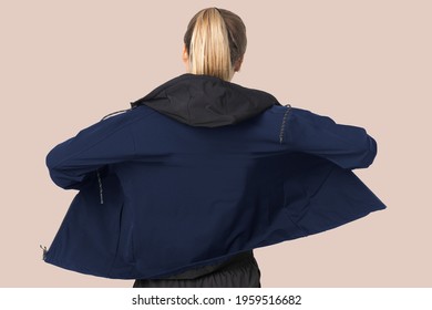 Blonde Woman In Windbreaker Jacket For Sportswear Fashion Photoshoot Rear View