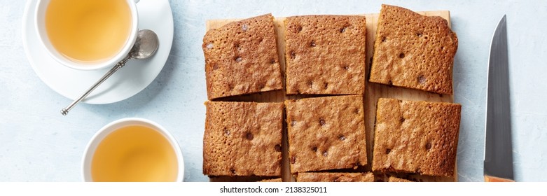 Blondie Brownie Dessert Bar With Chocolate Chips, Overhead Flat Lay Panorama With Tea