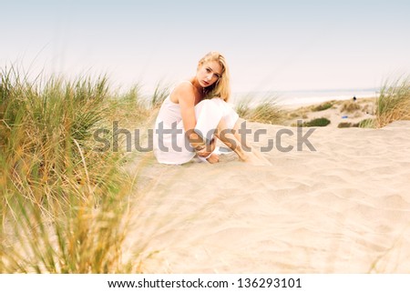 Similar – Young, slender, long-legged woman on a Baltic beach in a summer dress