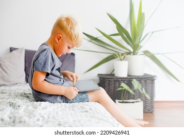 Blondy Boy Spend Your Leisure Time With Tablet At Home