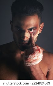 Blood, Boxing Injury And Man With Bruise From Fight Conflict, Criminal Violence Or Dark Crime With Middle Finger Emoji Sign. Shadow, Rebel Lifestyle And Portrait Of Mma Boxer With First Aid Bandage