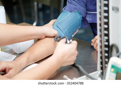 Blood Donation, Asian Male Blood Donor Measuring Blood Pressure By Mercury Sphygmonometer