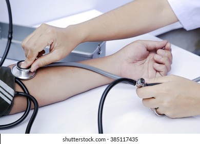 Blood Donation, Asian Male Blood Donor Measuring Blood Pressure By Mercury Sphygmonometer