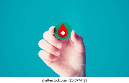 Blood Donation, World Blood Donor Day.Doctor Holding Red Blood With White Cross, Health Care, Marrow Cancer, Hemophilia Anemia.world Blood Day, Leukemia, Thalassemia Medical.hemophilia.Smear Test.