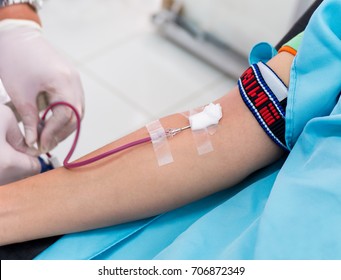 Blood Donor At Donation, Transfusion. Close Up Of Right Arm Of Asian Girls Receiving Blood With Copy Space Background. Healthcare And Charity. Concept For World Blood Donor Day - Selective Focus.