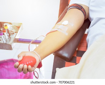 Blood Donor And Donation, Transfusion. Close Up Right Arm Of Asian Business Man Receiving Blood With Copy Space Background. Healthcare And Charity. Concept For World Blood Donor Day - Selective Focus.