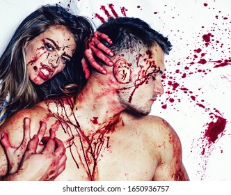 Blood Is Flowing Down The Neck, Bite Marks Are Visible. Sexy Woman Vampire Bites A Man's Neck. Woman With Red Blood And With Blond Hair. Killer, Maniac. Desire, Thirst Concept