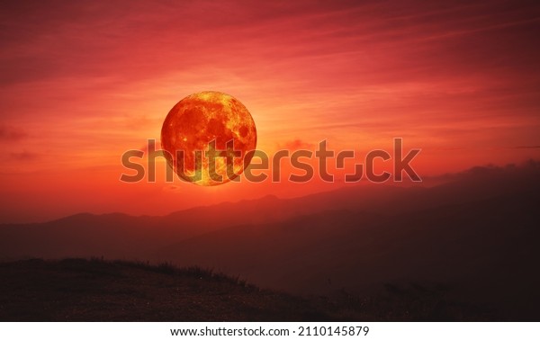 blood\
Moon,Red moon, real full blood moon in red sky with cloud over\
mountains.Elements of this image furnished by\
NASA.