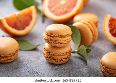 Blood Orange French Macarons With Fresh Fruit On The Table