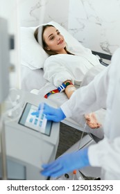 Blood Ozone Therapy. Woman At Blood Transfusion Treatment 