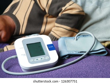 Blood Pressure Check , Doctor Checking Old Man Patient Arterial Blood Pressure. Health Care In Hospital. 