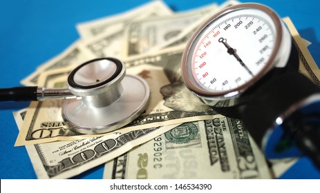 Blood Pressure Device And Stethoscope  With Money - High Costs Of Expensive Medication Concept 