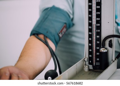 Blood Pressure Measurement Monitor Cuff On Arm Of Obesity Man, Processed With Vintage Style Color, Hypertension Concept