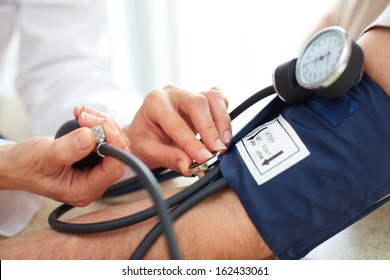 Blood pressure measuring. Doctor and patient.  Health care.