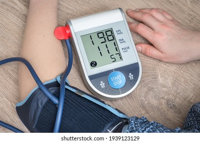 Blood Pressure Monitor With High Pressure Level On Screen - Hypertension Concept