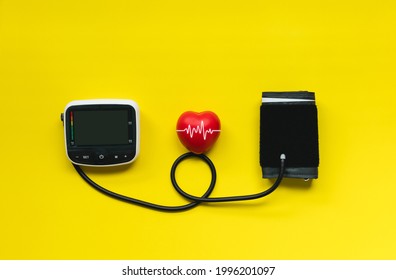 Blood Pressure Monitor Machine For Self Blood Pressure And Heart Rate Measurement With Red Heart, Healthcare And Medical Concept