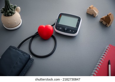 Blood Pressure Monitor Machine For Self Blood Pressure And Heart Rate Measurement With Red Heart, Healthcare And Medical Concept