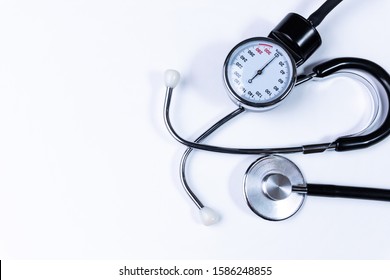 Blood pressure monitor and stethoscope. Medical sphygmomanometer for blood pressure control isolated on white