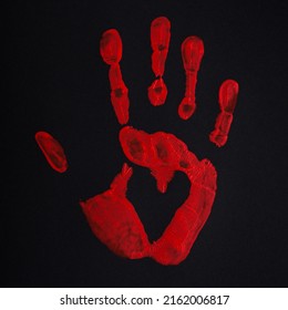 Blood red palm print with heart on black background. Stop bloodshed and war sign, peace concept.