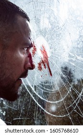 Blood Stain At Smashed Window Glass. Mens Power And Strength. Mens Style And Fashion Concept. Strong Horny Man Breaking Window Glass. Bloodstains At Broken Crushed Glass