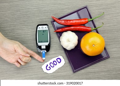 Blood Sugar Measurement, Diabetic Kit, Blood Glucose Meter Test And Herbs. Healthy Food Eating Concept. Orange, Garlic, Chilli.