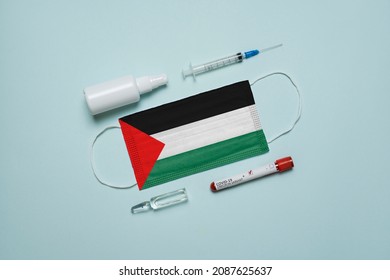 Blood Tube For Test Detection Of Virus Covid-19 Omicron Variant With Positive Result, Medicine Mask With Palestine Flag Superimposed And Vaccine.  New Variant Of The Covid-19 Omicron