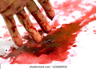 
Bloodied Hand Lies In A Pool Of Blood