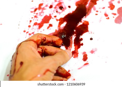 
Bloodied Hand Lies In A Pool Of Blood