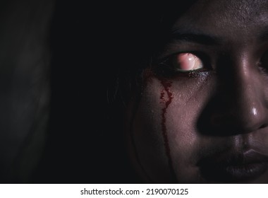 Bloody Halloween Makeup. Close Up Of Horror Bloodthirsty Ghost Female With Fade Drop Out From Eyes, Asian Woman With Blood Eye She Death And Scary With Blood Tear On Face, Happy Halloween Day Concept