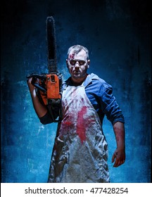 Bloody Halloween Theme: Crazy Killer As Butcher With Electric Saw