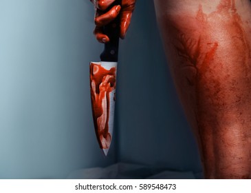 Bloody Hand With Knife Of Depressed Woman In Shower