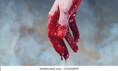 bloody hands, blood dripping from his hands. copy space.