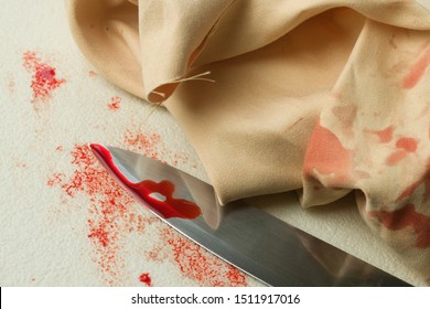 Bloody Knife With Blood Stained Carpet And Cloth