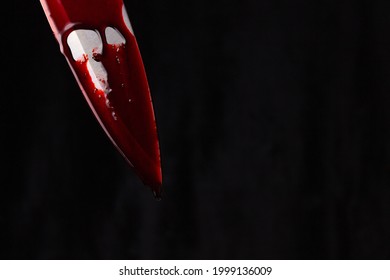 A Bloody Knife On A Black Background. The Concept Of Murder, Crime.